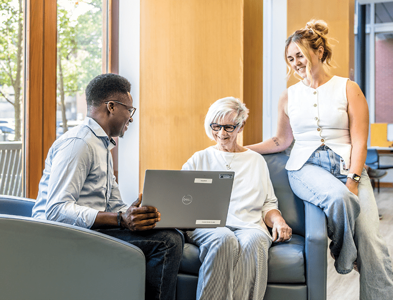 A WRHN team member consulting with a patient and her daughter.