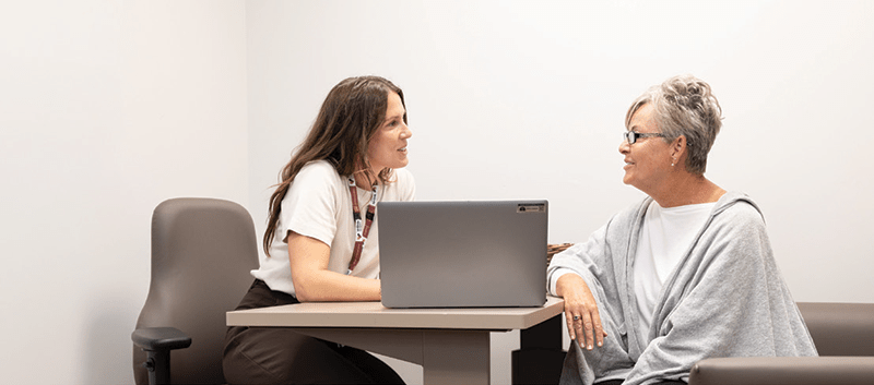 A WRHN team member consulting with a patient.