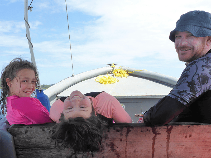 Photo: Lane on a boat with his daughters