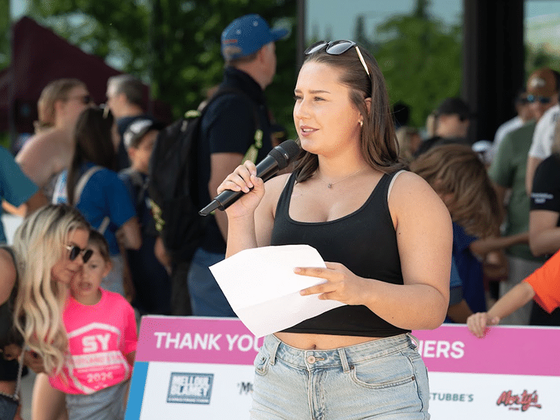 Photo: Mel Austin speaking at Scotland's Yard Road Hockey Classic 2026